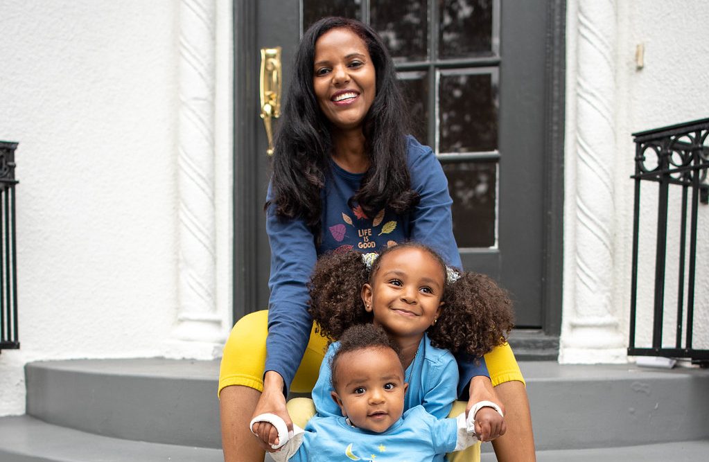 Mom on stairs with children