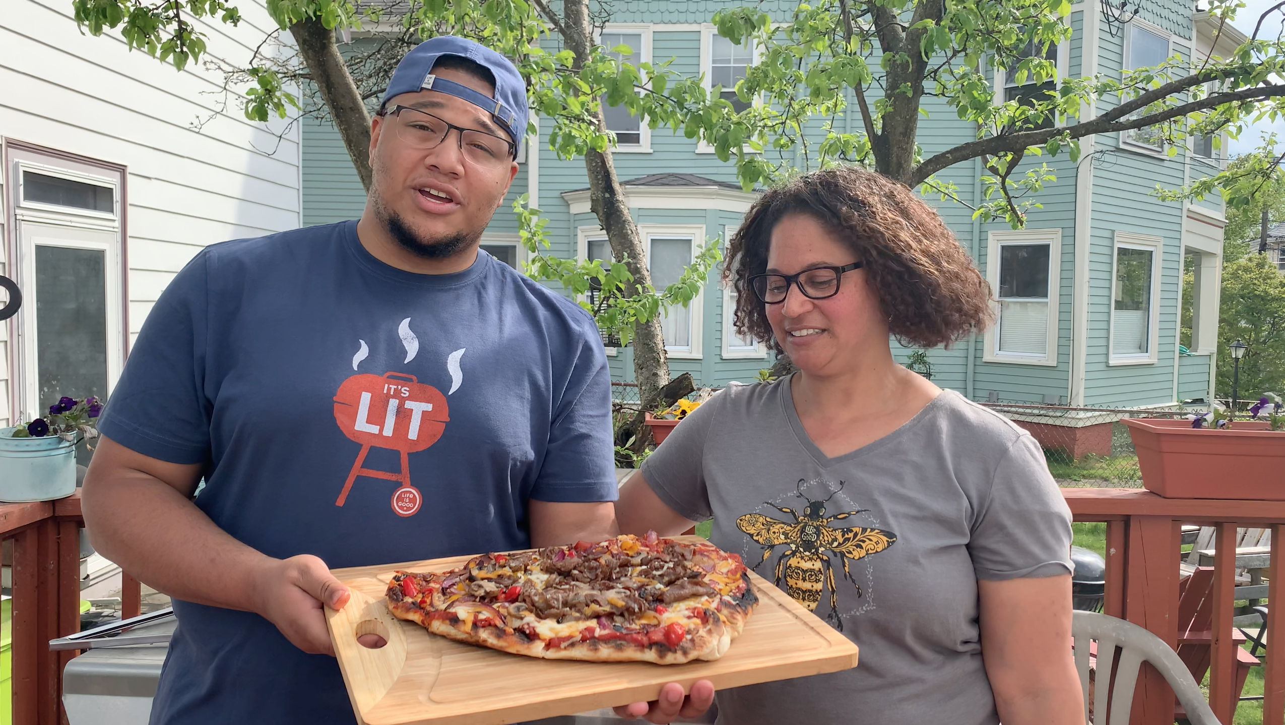 Screen Shot 2020-05-19 at 3.36.10 PM Marcus and his mom holding pizza