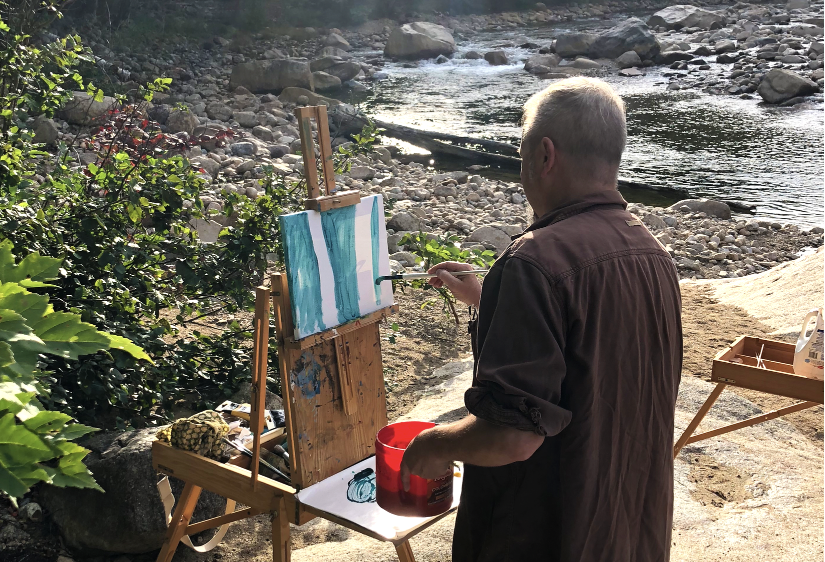 bill painting near water Bill painting near water