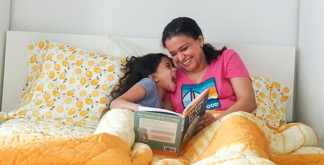 mom and daughter laughing