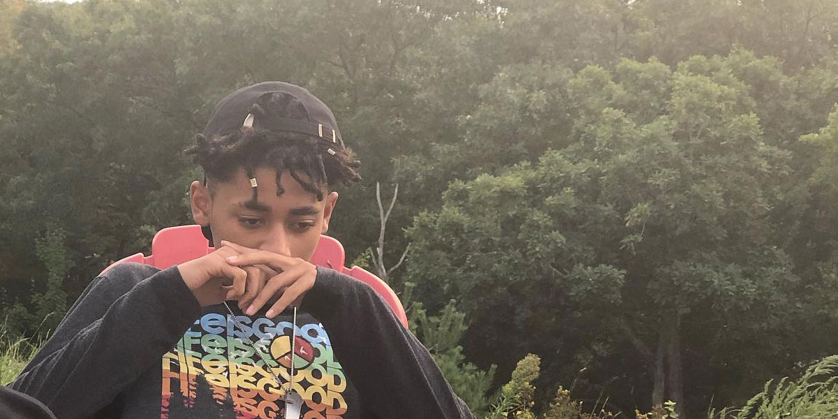 thinknovianwright_1 man seated in chair looking down